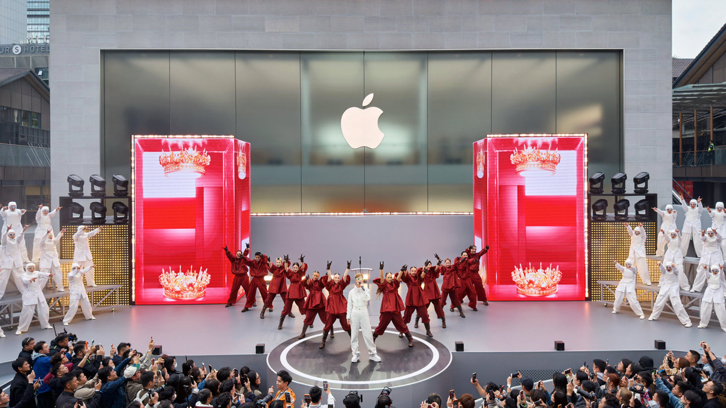 Chris Lee and her backup dancers pictured performing on a stage outside Apple Taikoo Li Chengdu in China.