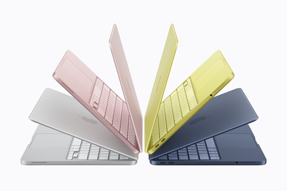 A fanned-out array of MacBook Neo models in its four colours: silver, blush, citrus, and indigo.