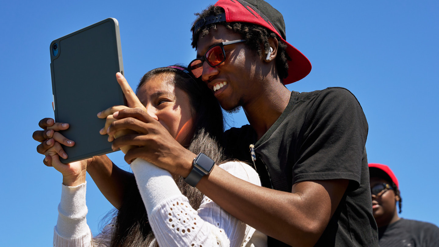 Photography for All participants Alaula Sprecher, Glen-David Hardy-Covington, and John Johnson use iPad to capture the world around them.