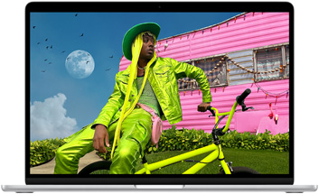 Οθόνη MacBook Air που δείχνει τη φωτογραφία ενός ατόμου με πολύχρωμα ρούχα, επιδεικνύοντας το εύρος χρωμάτων και την ανάλυση της οθόνης Liquid Retina