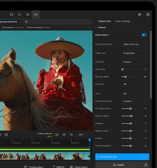 A MacBook Pro screen showing a video getting enhanced with AI in Topaz Video